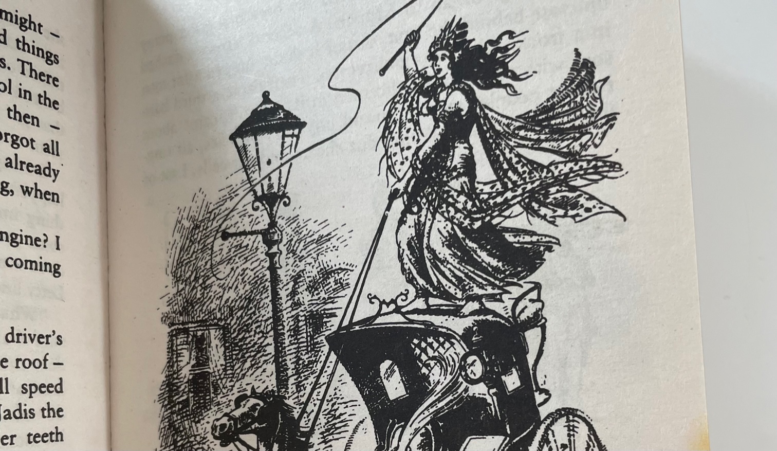 Illustration of Empress Jadis riding on top of a horse-drawn carriage.
